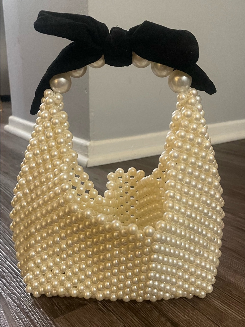 Elegant Pearl Handle Bag with Black Bow